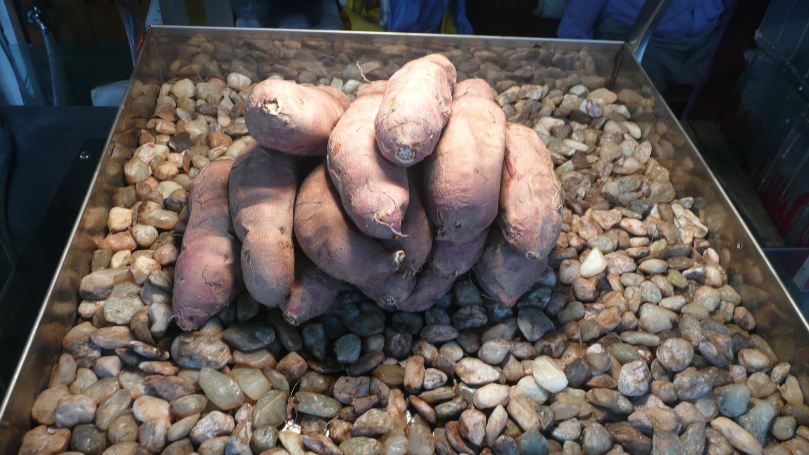 Korean street vendor selling roasted sweet potatoes