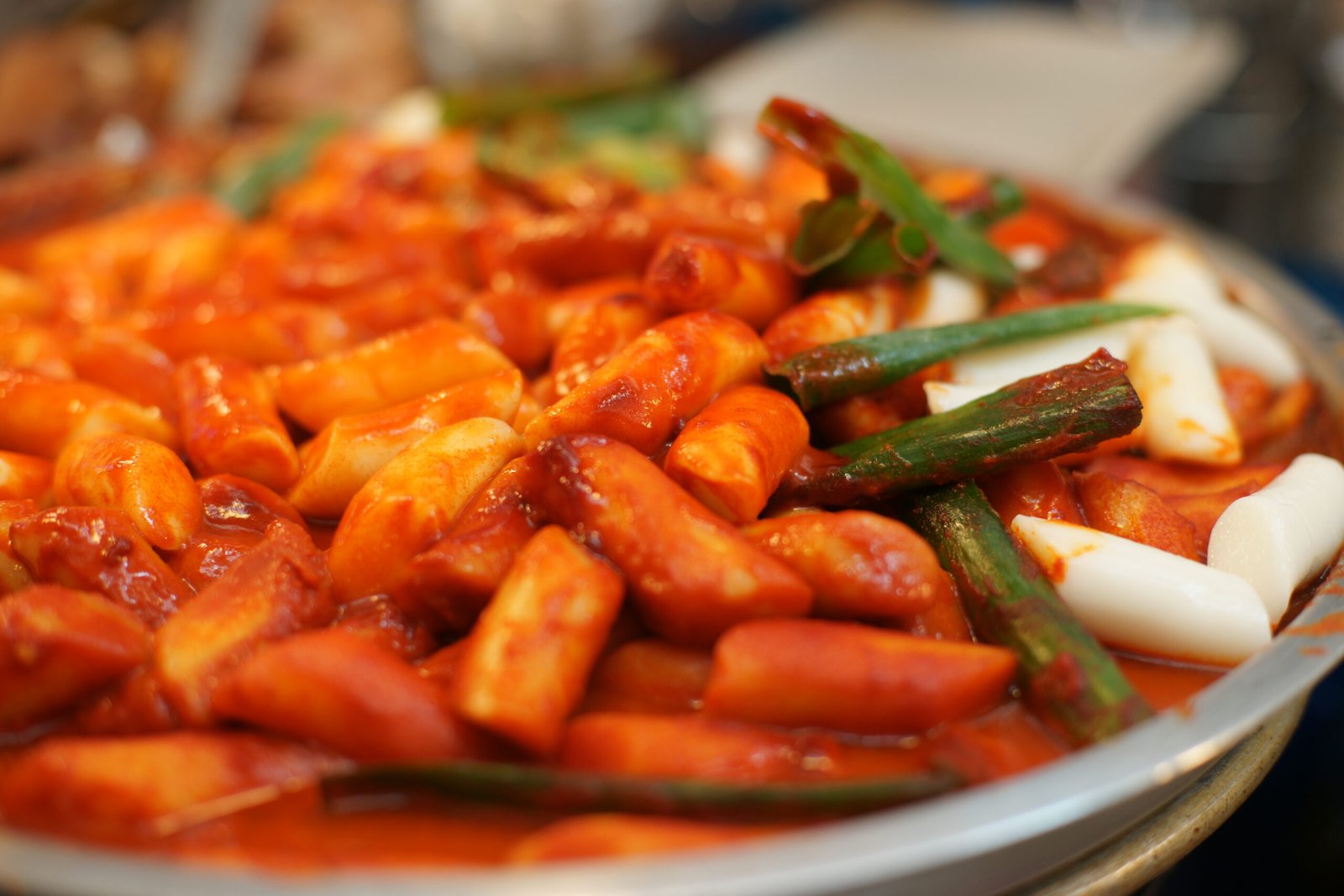 Tteokbokki (Korean spicy rice cakes) in rich red gochujang sauce with fish cakes